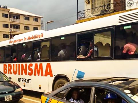 A long bus along Kissy Road in the east end of Freetown