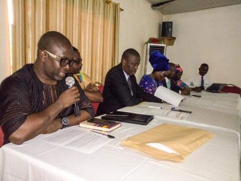 Action AId Executive Director and officials at the high table