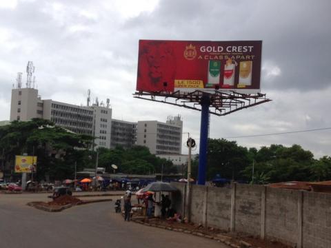 A billboard in Freetown displays three brands of cigarette sold in Sierra Leone