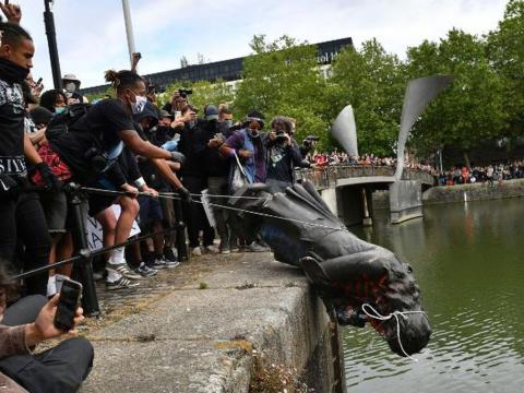 Anti-racism protesters tear down a statue of 17th century slave owner Edward Colston in Bristol