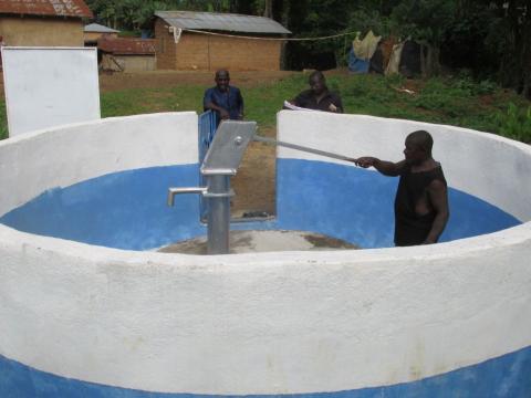 Chief Tamba William of Moigbedu Village in Kono District demonstrates a fault with the village’s only modern source of safe drinking water.