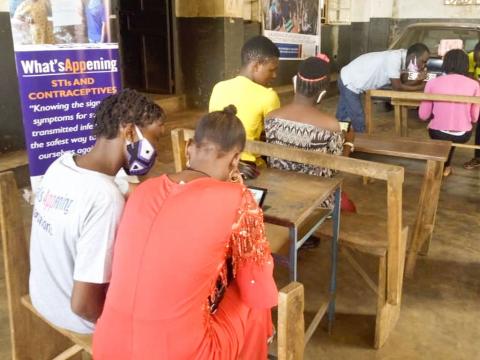 Children participating in a  training on the use of an app