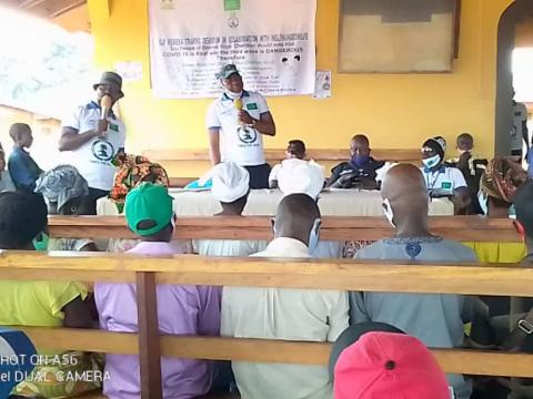 DTO ASP Amara Moijueh talking to the people of Koya  , Boama.