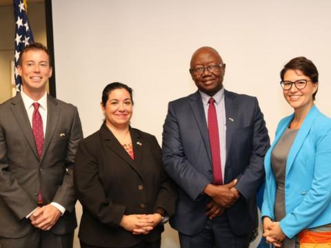 Energy Minister Kanja Sesay poses with US officials