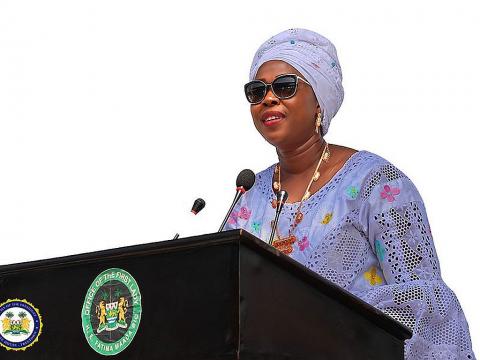 First Lady, Fatima Bio reading the report card to President Bio