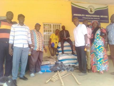 Members of the various cooperative farmers and staff of SLPMB pose with some of the prizes