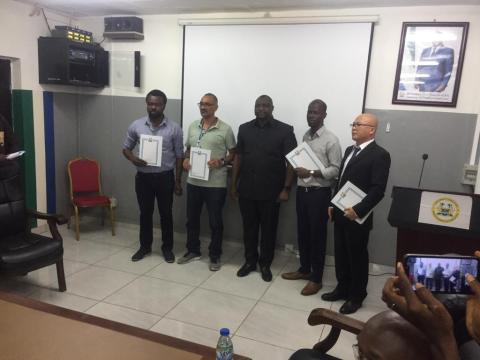 Minister of Trade and Industry, Dr. Edward Hinga Sandy, and representatives of the four factories at the signing ceremony