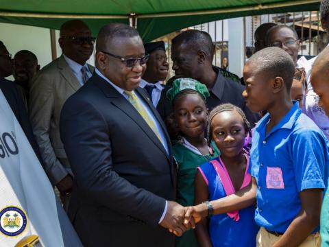 President Bio interacts with pupils at the State House ceremony