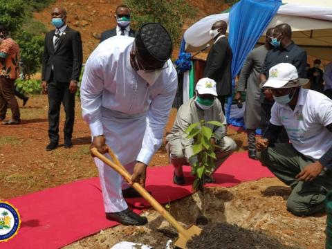 President Bio planting a tree