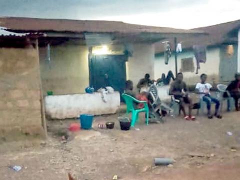 Quarantined residents in Baoma in Bo District, after a riot over lack of food