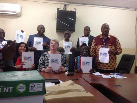 Stakeholders pose with copies of key indicators in the 2019 DHS