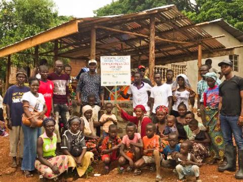 Kober Water community in front of their hut