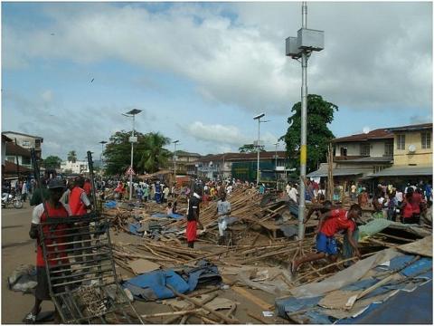 Traders picking their bits and pieces immediately after the demolition at Humunya Avenue